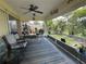 Relaxing screened patio with comfortable seating and views of the private, fenced backyard at 4027 Allure Ln, North Port, FL 34287