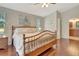 Bedroom boasts hardwood floors, ensuite bathroom, and a large window for plenty of natural light at 4322 Concert St, Port Charlotte, FL 33948