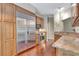 Kitchen featuring stainless steel refrigerator and wooden cabinets at 4322 Concert St, Port Charlotte, FL 33948