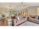 Comfortable living room featuring hardwood floors, fan, and stylish furnishings at 4322 Concert St, Port Charlotte, FL 33948