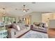 Bright living room with hardwood floors, vaulted ceilings, and an open layout to adjacent spaces at 4322 Concert St, Port Charlotte, FL 33948