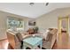 Spacious living room with hardwood floors, vaulted ceilings, and comfortable seating arrangement at 4322 Concert St, Port Charlotte, FL 33948