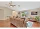 Comfortable living room with hardwood floors, vaulted ceilings, and a large window for natural light at 4322 Concert St, Port Charlotte, FL 33948