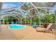 Relaxing screened pool area with multiple seating options, perfect for enjoying the Florida sunshine at 4322 Concert St, Port Charlotte, FL 33948