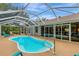 Spacious screened pool with plenty of room for entertaining and enjoying the Florida lifestyle at 4322 Concert St, Port Charlotte, FL 33948