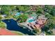 Aerial view of community amenities including pools, tennis courts, and lakes at 4325 46Th W Ave # 203, Bradenton, FL 34210