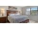 Inviting bedroom with a comfortable bed, natural light from the window, and a serene ambiance at 4325 46Th W Ave # 203, Bradenton, FL 34210