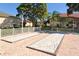 Community outdoor bocce ball courts with sand and seating overlooking residences at 4325 46Th W Ave # 203, Bradenton, FL 34210