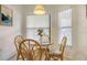 Bright dining area with a glass-top table and views of the community at 4325 46Th W Ave # 203, Bradenton, FL 34210