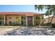 Exterior of a well-maintained two-story condo building with ample parking at 4325 46Th W Ave # 203, Bradenton, FL 34210