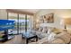 Comfortable living room with sliding glass doors and a view of the community at 4325 46Th W Ave # 203, Bradenton, FL 34210