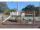 Outdoor community playground with a slide, swings, and climbing stairs at 4325 46Th W Ave # 203, Bradenton, FL 34210