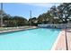 Community pool with an expansive deck with many lounge chairs for relaxing poolside at 4325 46Th W Ave # 203, Bradenton, FL 34210
