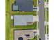 Top-down aerial view of home, showing roof, backyard patio, and proximity to the street and neighboring houses at 4407 Big Woods Way, Parrish, FL 34219
