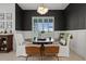 Dining room with decorative lighting, wainscoting, and comfortable seating at 4407 Big Woods Way, Parrish, FL 34219