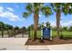 Community dog park featuring a secure fenced area with rules posted and palm trees at 4407 Big Woods Way, Parrish, FL 34219