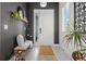 Stylish entryway featuring a white front door, shuttered windows, and decorative elements at 4407 Big Woods Way, Parrish, FL 34219