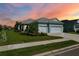 Charming single-story home with a well-manicured lawn, complemented by fresh landscaping, and a convenient two-car garage at 4407 Big Woods Way, Parrish, FL 34219