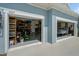 The exterior shows the garage with equipment, storage and a vehicle under a tarp at 4407 Big Woods Way, Parrish, FL 34219