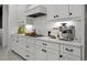Kitchen featuring white cabinets, stainless steel appliances, and plenty of counter space at 4407 Big Woods Way, Parrish, FL 34219