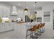 Modern kitchen with white cabinetry, stainless steel appliances, and a large island at 4407 Big Woods Way, Parrish, FL 34219