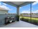 Relaxing screened lanai offers serene views of the lake and landscaped backyard at 4407 Big Woods Way, Parrish, FL 34219