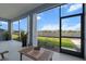 Well lit screened lanai offers serene views of the lake and landscaped backyard at 4407 Big Woods Way, Parrish, FL 34219