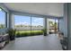 Beautiful lanai with blue walls, stylish decor, and expansive views of the lake at 4407 Big Woods Way, Parrish, FL 34219