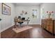 Bright office with hardwood floors, plantation shutters, decor, and rustic wood desk and cabinet at 4407 Big Woods Way, Parrish, FL 34219