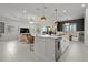 Open concept living, dining, and kitchen area at 4407 Big Woods Way, Parrish, FL 34219