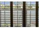Exterior lake view from interior through shutters at 4407 Big Woods Way, Parrish, FL 34219