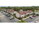 Aerial view of the residential complex with parking and surrounding greenery at 4475 Sandner Dr, Sarasota, FL 34243