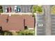 Overhead view of the building's roof, parking lot, and lush surroundings at 4475 Sandner Dr, Sarasota, FL 34243