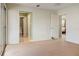 Spacious bedroom with carpet and doors to the bathroom and another bedroom at 4475 Sandner Dr, Sarasota, FL 34243