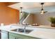 Open kitchen design featuring a stainless steel sink and bar top seating at 4475 Sandner Dr, Sarasota, FL 34243