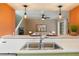 Open kitchen with stainless steel sink looking into the living room at 4475 Sandner Dr, Sarasota, FL 34243
