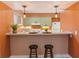 Kitchen with a breakfast bar and modern pendant lighting at 4475 Sandner Dr, Sarasota, FL 34243