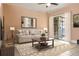 Inviting living room with a comfortable couch, rug, and sliding glass doors at 4475 Sandner Dr, Sarasota, FL 34243
