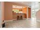 Open concept living area with tile flooring looking into the kitchen at 4475 Sandner Dr, Sarasota, FL 34243