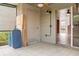Screened in patio area with a storage closet and sliding door access to the interior at 4475 Sandner Dr, Sarasota, FL 34243