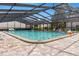 A clear screened community pool with comfortable lounge seating is available for residents at 4475 Sandner Dr, Sarasota, FL 34243