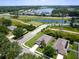 A beautiful home surrounded by lush greenery and a serene lake creating an inviting neighborhood at 4615 73Rd E St, Bradenton, FL 34203