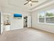 This primary bedroom features neutral walls, carpet flooring, a window, closet, and view to the breakfast nook at 4615 73Rd E St, Bradenton, FL 34203