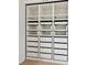 This walk-in closet features custom shelving and drawer units, offering lots of storage space at 4615 73Rd E St, Bradenton, FL 34203