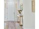 Bright foyer with elegant decor, a stylish console table, and a patterned rug at 4615 73Rd E St, Bradenton, FL 34203
