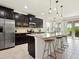 Modern kitchen with stainless steel appliances, a large island, and barstool seating at 4615 73Rd E St, Bradenton, FL 34203