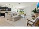 Open-concept living area featuring a comfortable sectional sofa and abundant natural light at 4615 73Rd E St, Bradenton, FL 34203