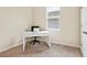 This office features carpet flooring, a window, a desk, and an office chair, creating a functional workspace at 4615 73Rd E St, Bradenton, FL 34203