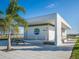 Modern park building with picnic table and palm tree, showcasing the Nathan Benderson Park logo at 4615 73Rd E St, Bradenton, FL 34203
