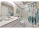 Bathroom with a shower-tub combination and a decorative shower curtain at 4650 Ringwood Meadow # 37, Sarasota, FL 34235